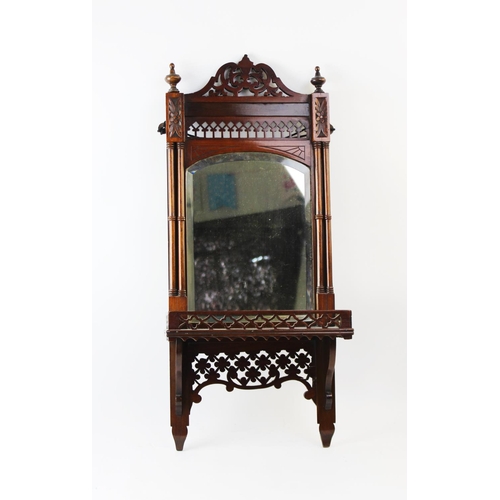 901 - An early 20th century Chinese Chippendale revival mirrored wall bracket, the arched bevelled mirrore... 