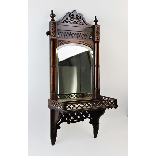 901 - An early 20th century Chinese Chippendale revival mirrored wall bracket, the arched bevelled mirrore... 