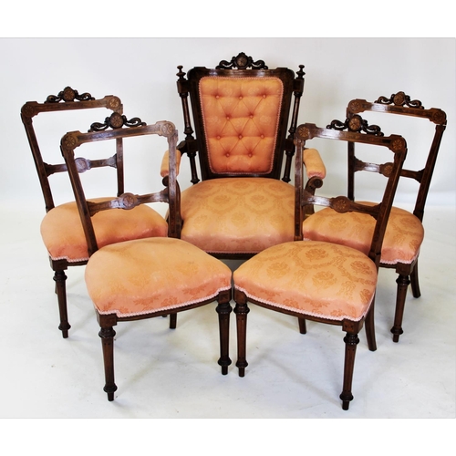 907 - An Edwardian inlaid walnut parlour suite, the open armchair with a carved leaf swept crest above a b... 