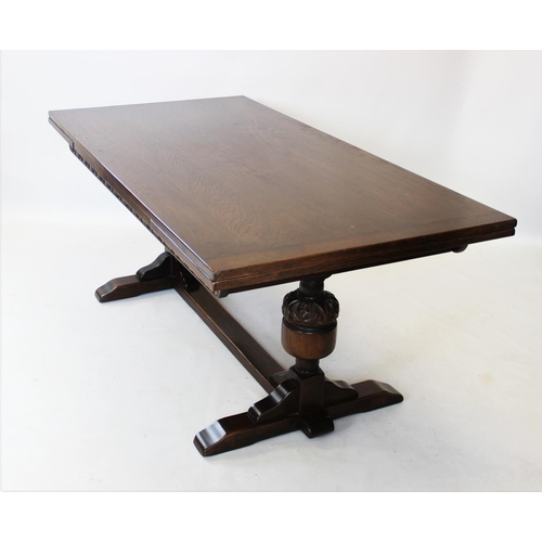 909 - A 17th century style oak refectory table, early 20th century, the rectangular draw leaf top raised u... 