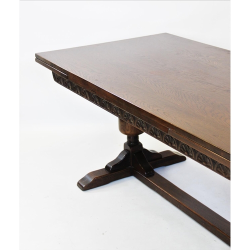 909 - A 17th century style oak refectory table, early 20th century, the rectangular draw leaf top raised u... 