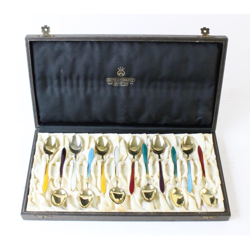 60 - A set of twelve Norwegian silver gilt enamelled teaspoons by David Andersen, each with enamelled dec... 