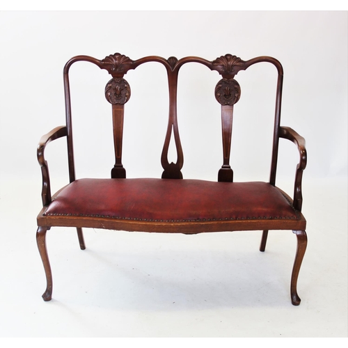 889 - An early 20th century Chippendale revival twin seat mahogany chair, with two carved shell crests abo... 