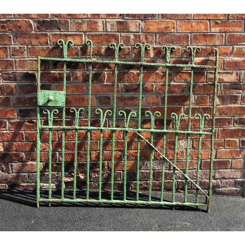 912 - An early 19th century wrought iron garden gate, with scroll terminals on full length bars, punctuate... 