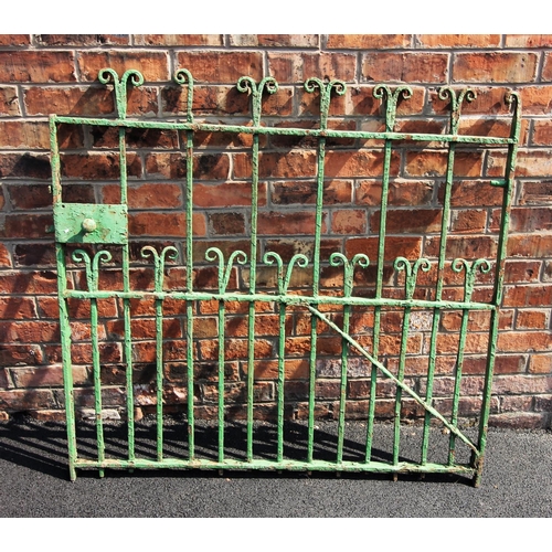 912 - An early 19th century wrought iron garden gate, with scroll terminals on full length bars, punctuate... 