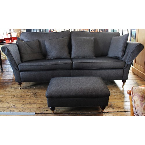 908 - A late 20th century Duresta three seater sofa with footstool, covered in herringbone tweed fabric, t... 