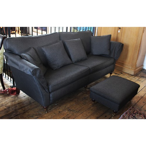 908 - A late 20th century Duresta three seater sofa with footstool, covered in herringbone tweed fabric, t... 