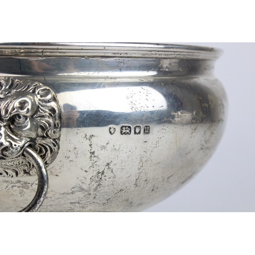 2 - A silver punch bowl by Edward Barnard & Sons Ltd, London 1935, of circular form on pedestal foot, wi... 