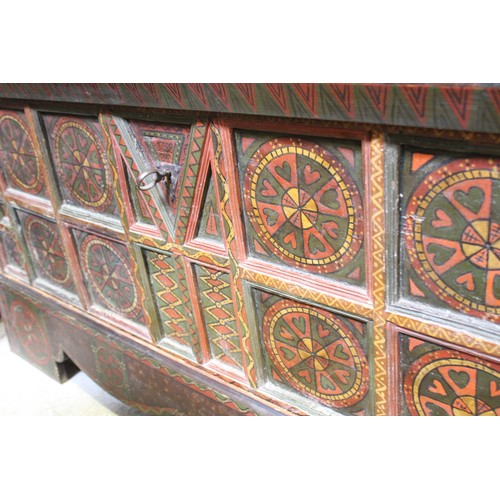 870 - A 19th century Eastern European painted folk art pine chest, painted with geometric designs, the hin... 