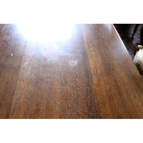 852 - A 17th century style oak plank top table, 20th century, the cleated plank top raised upon ring turne... 