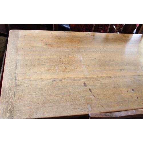 852 - A 17th century style oak plank top table, 20th century, the cleated plank top raised upon ring turne... 