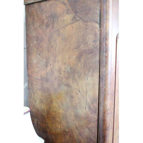 869 - A Victorian burr walnut breakfront triple wardrobe, the stepped cavetto cornice above a central mirr... 