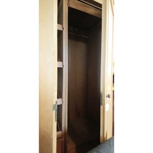 838 - A Victorian pine double wardrobe, with a cavetto cornice above a pair of panelled doors, the left ha... 