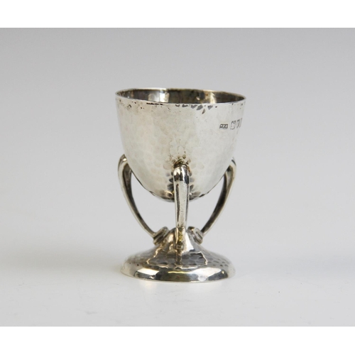 114 - A silver Arts & Crafts egg cup by Philip Hanson Abbot, London 1912, the tapered bowl on curved legs ... 