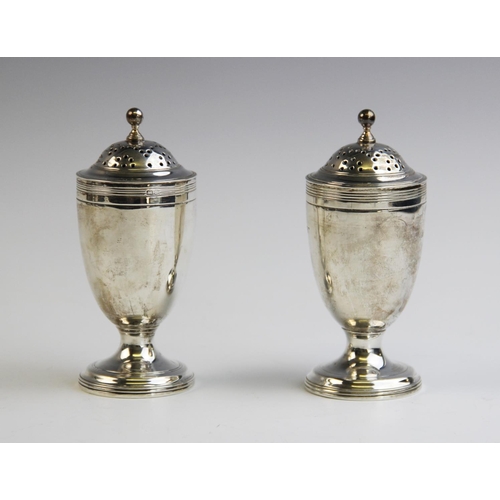 115 - A pair of George V silver pepperettes by George Nathan & Ridley Hayes, Chester 1911, of plain polish... 