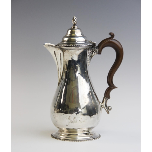 118 - A George V silver hot water jug by George Nathan & Ridley Hayes, Chester 1914, of baluster form on s... 