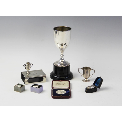 128 - A silver trophy cup on stand by Emile Viner, Sheffield 1961, of tapering cylindrical form with knopp... 