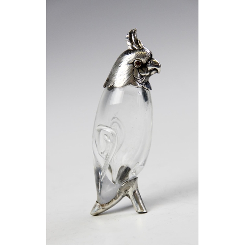 130 - A Victorian silver and glass pepperette modelled as a cockatoo by Henry William Curry, London 1883, ... 