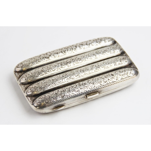 33 - A George V silver cigar case by John Rose, Birmingham 1913, of typical form with scrolling foliate d... 