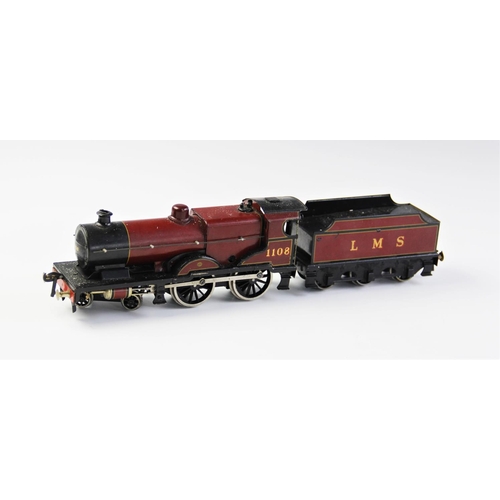 643 - An O Gauge clockwork 4-4-0 locomotive and tender, probably by Bassett-Lowke, in maroon L.M.S. livery... 