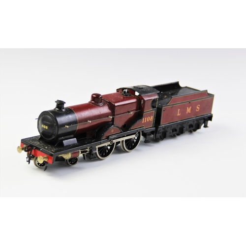 643 - An O Gauge clockwork 4-4-0 locomotive and tender, probably by Bassett-Lowke, in maroon L.M.S. livery... 