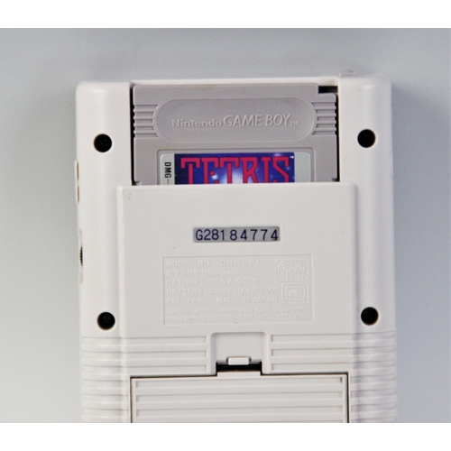 648 - A 1989 Nintendo Gameboy, model number DMG-01, serial number G281 84774, with an unboxed Tetris game ... 