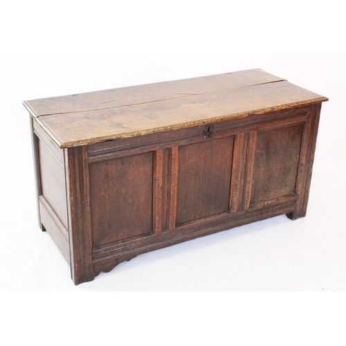 679 - An 18th century and later oak coffer, the rectangular moulded two plank hinged cover enclosing a fit... 