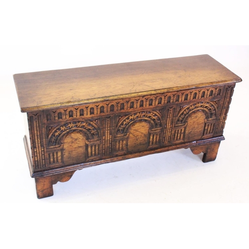 684 - A 17th century style oak coffer, mid 20th century, the rectangular moulded top above a nulled frieze... 