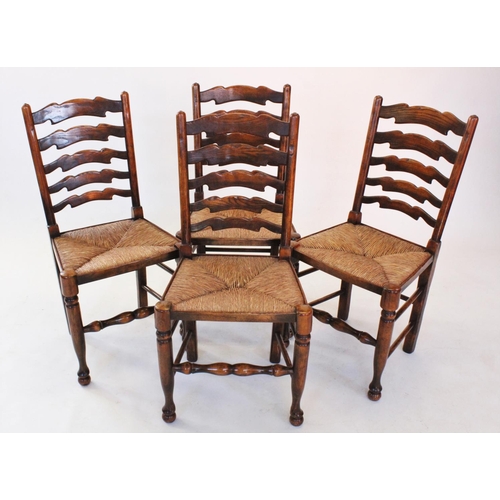 685 - A set of 18th century style oak ladder back kitchen chairs, late 20th century, each with five gradua... 