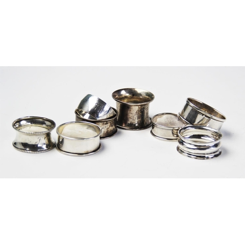 69 - A selection if eight Edwardian and later silver napkin rings, to include and example by Williams Ltd... 