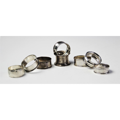 69 - A selection if eight Edwardian and later silver napkin rings, to include and example by Williams Ltd... 