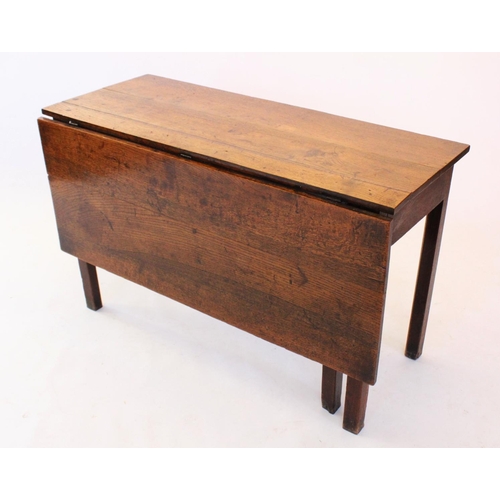 696 - A late 18th/early 19th century oak single drop leaf table, the rectangular top above a plain frieze,... 