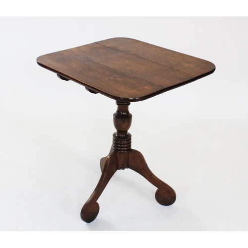 698 - A George III oak tripod table, the rectangular top with rounded corners, raised upon a ring turned b... 