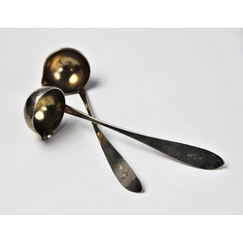 70 - A pair of 19th century continental silver cream ladles, the handles engraved with thistles, stamped ... 