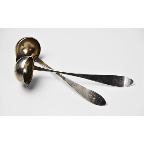 70 - A pair of 19th century continental silver cream ladles, the handles engraved with thistles, stamped ... 