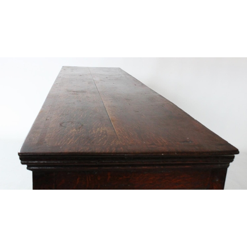 706 - A George III oak and mahogany cross banded dresser base, the rectangular cross banded top with round... 