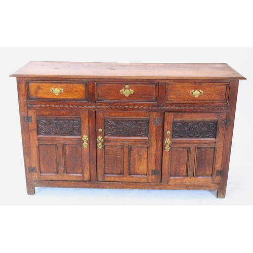 711 - A 19th century oak dresser base/sideboard, the rectangular thumb moulded top above three invert moul... 