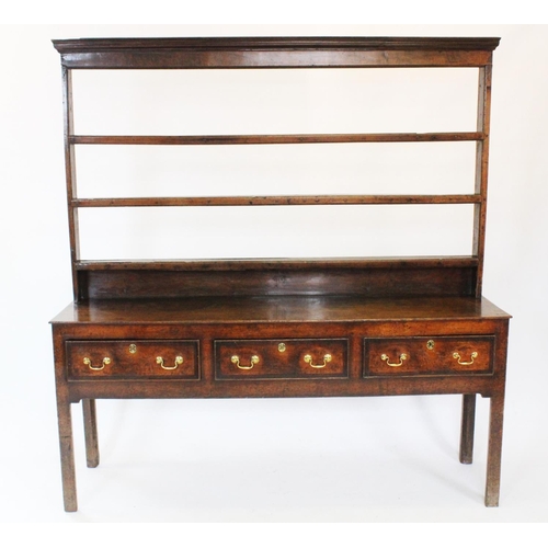 716 - A George III oak Welsh dresser, the associated open plate rack with three shelves upon the base with... 