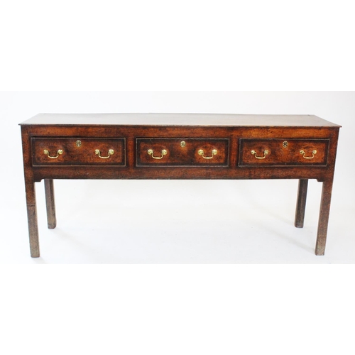 716 - A George III oak Welsh dresser, the associated open plate rack with three shelves upon the base with... 