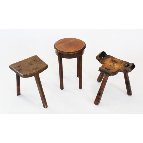 735 - A 19th century elm milking stool, the 'D' shaped seat raised upon three chamfered legs, 39cm high, s... 