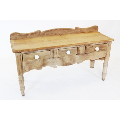 755 - A Victorian pine serving table/dresser, with a shaped raised back above a rectangular slab top and t... 