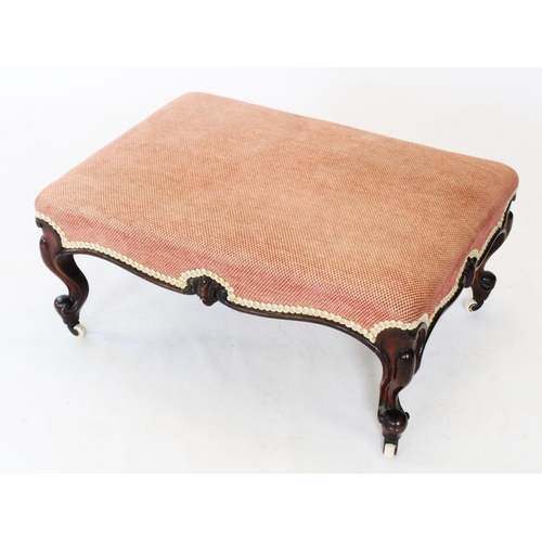 764 - A mid 19th century walnut and upholstered foot stool, the rectangular upholstered seat raised upon c... 