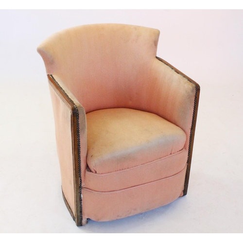 776 - A late 19th/early 20th century tub chair, the concave padded back rest flanked by angular arm rests ... 