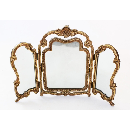 777 - A French style gilt and gesso triple dressing table mirror, mid 20th century, the moulded shell cres... 