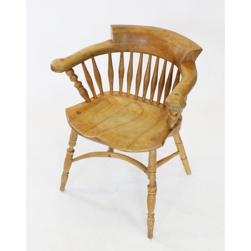 783 - A 19th century style blonde elm and ash smokers bow elbow chair, 20th century, the 'C' shaped arm re... 