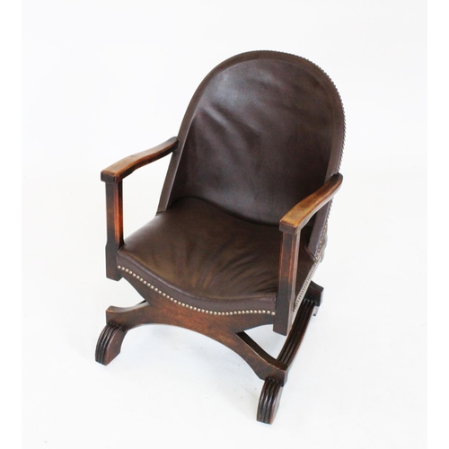 799 - An early 20th century Arts & Crafts stained beech and leatherette open armchair, the hoop back with ... 