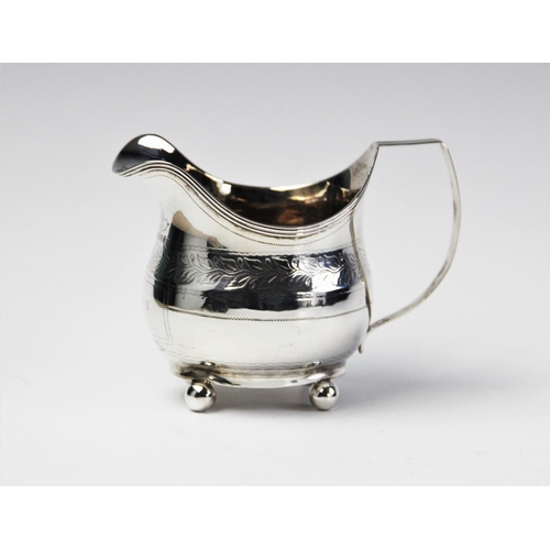 80 - A George III silver cream jug by John Merry, London 1812, of oval baluster form with engraved foliat... 