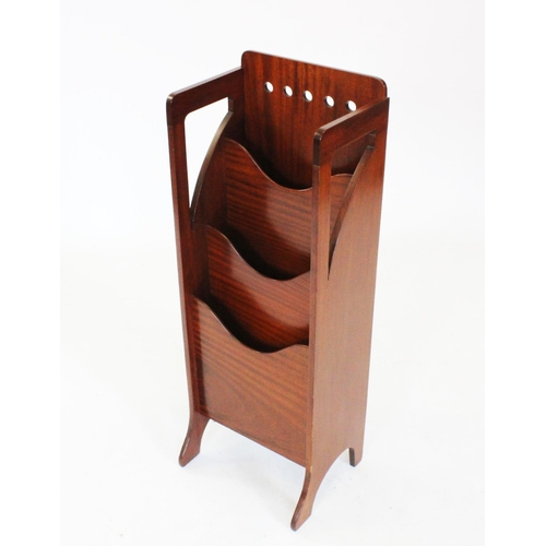 801 - An early 20th century Glasgow school Arts and Crafts vertical mahogany magazine rack, with a row of ... 