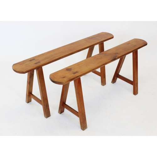 802 - A pair of French cherry wood benches, late 19th/ early 20th century, the slender rectangular tops wi... 