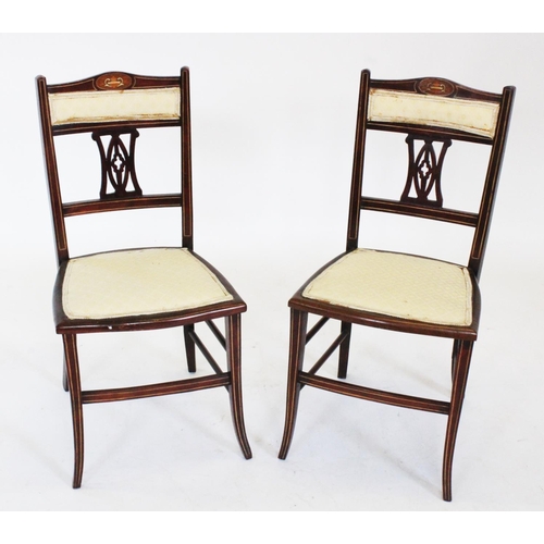 809 - A pair of Edwardian rosewood parlour chairs, each with a padded back rest above an inlaid and open w... 